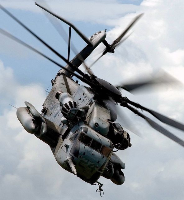 Military Transport Helicopter in Flight Against Cloudy Sky - Download Free Stock Photos Pikwizard.com