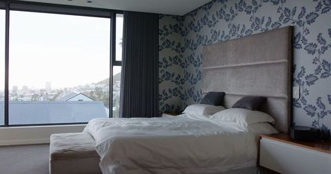 Luxurious Bedroom with City View and King-Size Bed