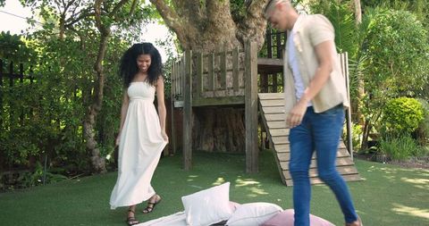 Couple enjoying relaxing picnic in garden setting