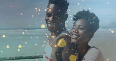 Smiling Couple Enjoying Romantic Beach Moment with Golden Bokeh