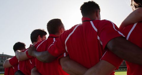 Diverse Rugby Team Huddling on the Field