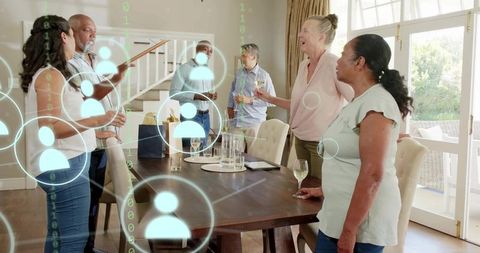 Multigenerational group standing, connecting at dining table with digital social network overlay
