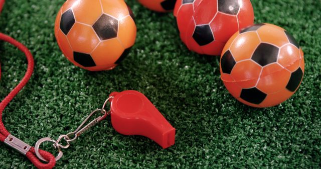 Orange Soccer Balls and Red Whistle on Artificial Grass - Download Free Stock Images Pikwizard.com