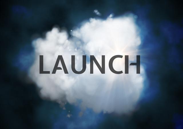 Digital composite image of launch text against blur cloud background