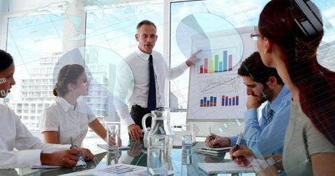 Businessman Analyzing Market Trends with Diverse Team - Download Free Stock Images Pikwizard.com