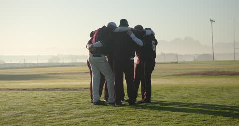 Baseball Team Huddling with Determination Before Game
