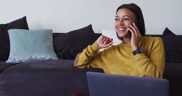 Smiling Woman Talking on Phone While Working from Home - Download Free Stock Images Pikwizard.com