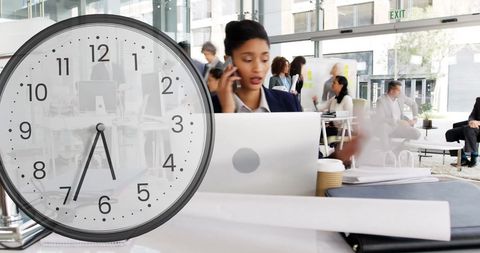 Time management in modern office with diverse professionals