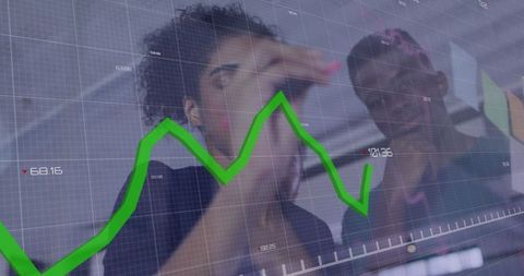 Diverse Colleagues Discuss Data Trends in Modern Office