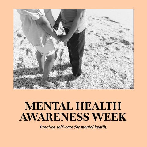Diverse couple holding hands at beach for mental health awareness