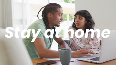 Couple Discussing with Laptop at Home with Motivational Message