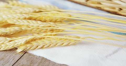 Close Up of Golden Wheat Ears on White Towel - Download Free Stock Images Pikwizard.com