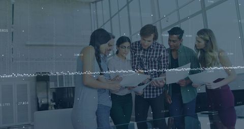 Business Team Working Seamlessly in Modern Office with Data Overlay