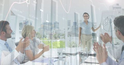 Diverse Business Team Applauding Presentation Success in Modern Office