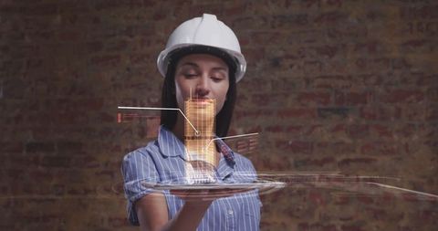 Female Architect Viewing 3D Building Hologram on Tablet