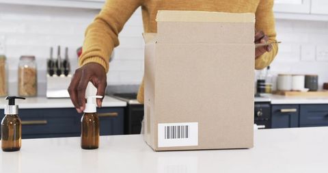 Packing artisanal products in kitchen workspace