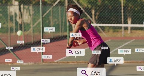 Focused Female Tennis Player Returning Ball on Outdoor Court
