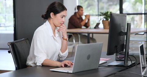 Focused Woman Collaborating in Modern Office Environment