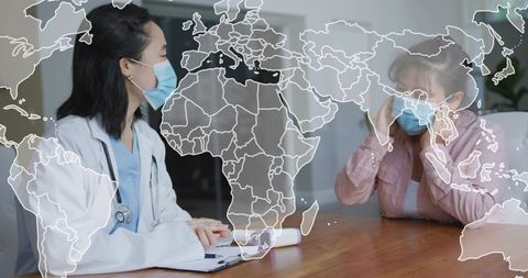 Doctor consulting senior patient wearing masks with world map overlay, global health theme