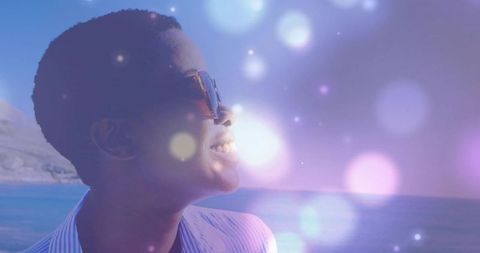 Woman Wearing Sunglasses Daydreaming by the Quiet Sea