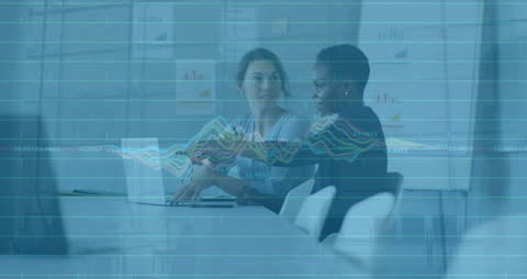 Diverse Professionals Analyzing Financial Data in Modern Office Setting