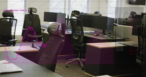 Ergonomic mesh office chair with monitors, laptop and suit jacket in modern workspace