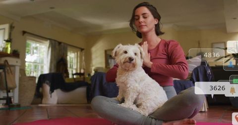 Woman Meditating with Dog in Cozy Living Room Setting