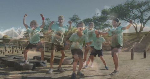 Energetic Children Flexing Muscles at Adventure Park