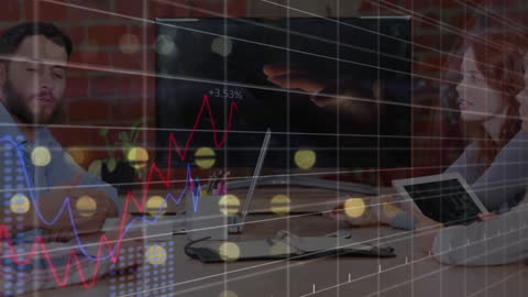 Colleagues Analyzing Statistical Data in Modern Meeting Room