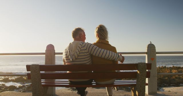 Senior Couple Hugging on Bench Overlooking Ocean at Sunset - Download Free Stock Images Pikwizard.com
