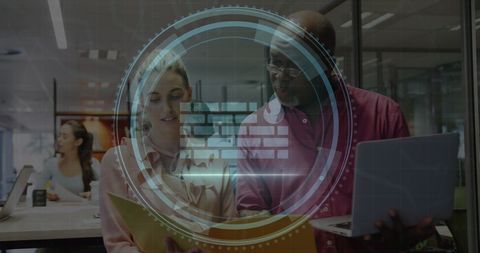 Colleagues collaborating in modern office with digital overlay