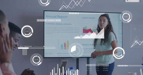 Businesswoman presenting analytics in modern office with infographics