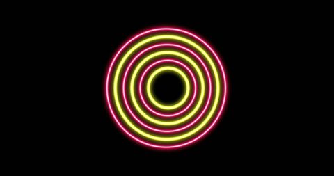 Glowing Pink and Yellow Circles on Black Background