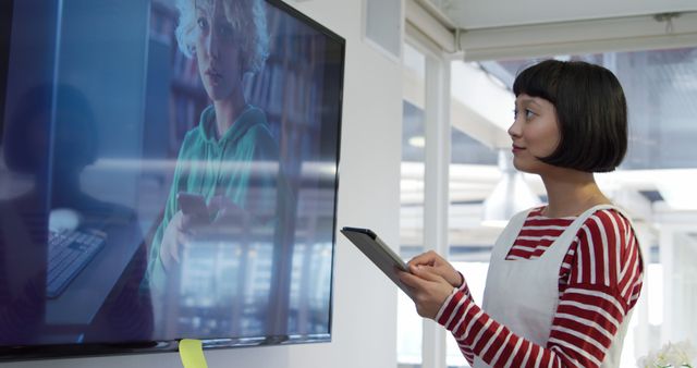 Young Woman Video Conferencing in Modern Office Environment - Download Free Stock Images Pikwizard.com