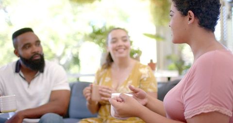 Friends Enjoying Coffee and Conversation Indoors
