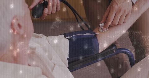 Doctor measuring blood pressure of senior with digital binary overlay