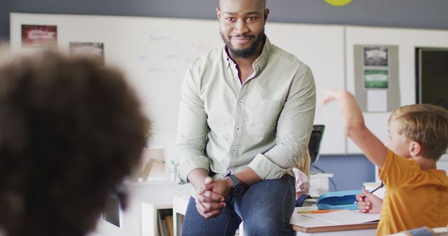 Confident Male African-American Teacher Interacting with Students in Classroom - Download Free Stock Images Pikwizard.com