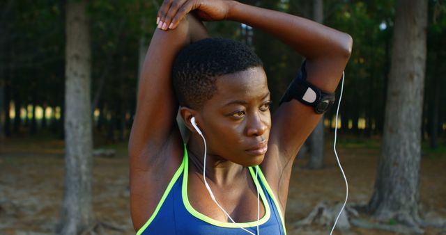 Athletic Woman Stretching in Forest - Download Free Stock Images Pikwizard.com