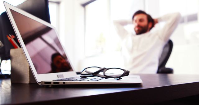 Relaxed Professional Taking a Break in Office - Download Free Stock Images Pikwizard.com