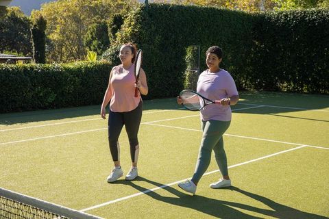 Diverse Female Friends Enjoying Outdoor Tennis Match