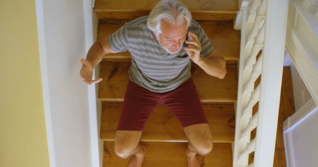 Elderly Man Sitting on Stairs and Talking on Phone - Download Free Stock Images Pikwizard.com