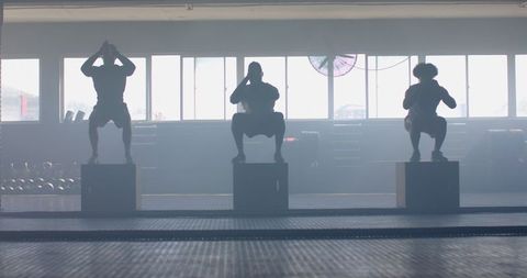 Focused Fitness Training with Box Jumps in Gym Setting