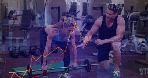 Female Athlete Performing Barbell Lift on Green Mat with Trainer and Performance Data