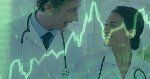 Physicians Discussing Patient Data with ECG Overlay in Clinic for Healthcare Analytics