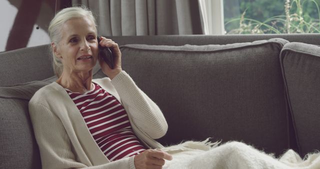 Senior Woman Speaking on Phone While Relaxing at Home - Download Free Stock Images Pikwizard.com