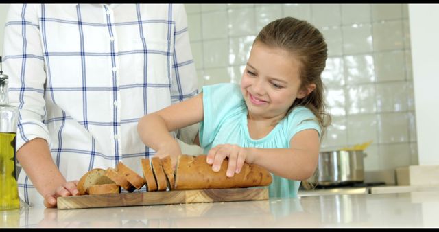 Child Slices Bread Learning Cooking in Bright Kitchen - Download Free Stock Images Pikwizard.com