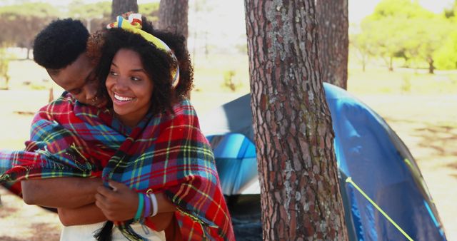 Young Couple Embracing by Tent During Camping Trip in Forest - Download Free Stock Images Pikwizard.com