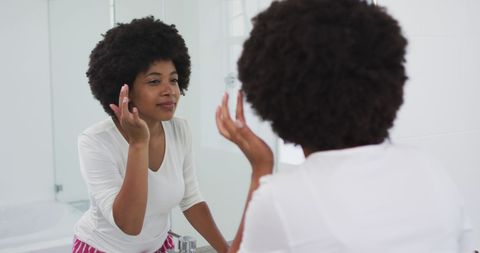 African American Woman Whitening at Bathroom Mirror - Download Free Stock Images Pikwizard.com