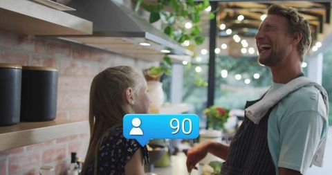 Father and Daughter Enjoy Cooking Together at Home