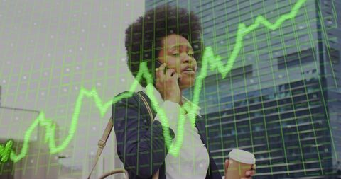 Business Woman Analyzing Data with Graph Overlay